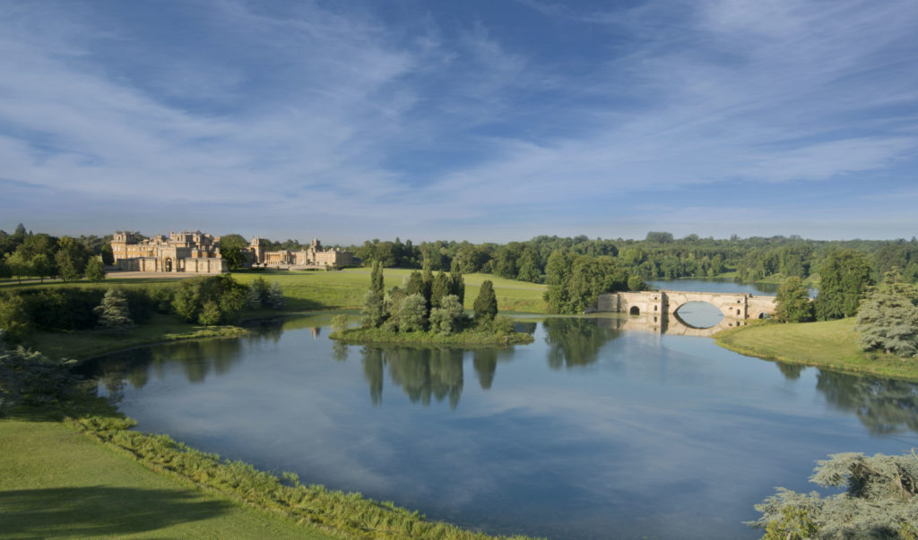 View across the lake with the Grand Bridge, the palace in the background. Grounds designed by Capability Brown.